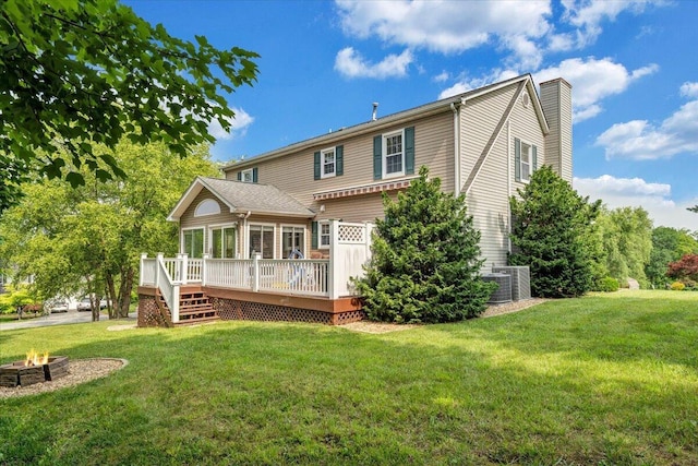201 Jay Ridge Rd, Cloverdale, VA 24077 - rear view of property featuring a fire pit, a deck, a chimney, and a lawn