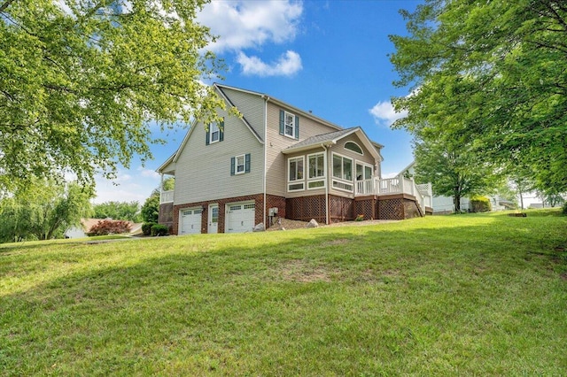 201 Jay Ridge Rd, Cloverdale, VA 24077 - back of property featuring an attached garage, a sunroom, a lawn, brick siding, and a wooden deck