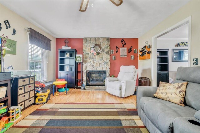 201 Jay Ridge Rd, Cloverdale, VA 24077 - living area with wood finished floors, a fireplace, and ceiling fan