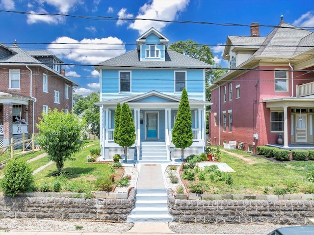 825 Day Ave SW, Roanoke, VA 24016 - american foursquare style home with covered porch, a front yard, and stairs