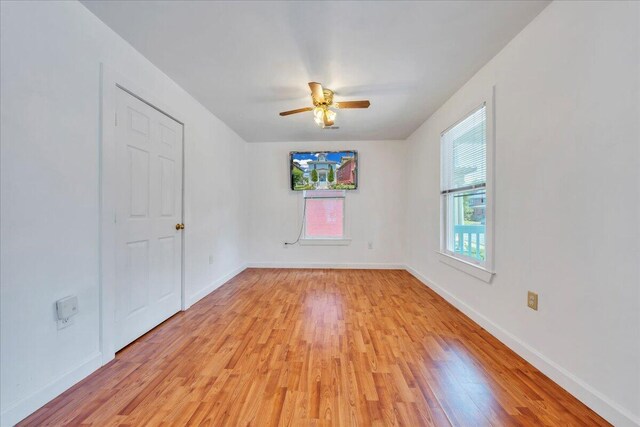 825 Day Ave SW, Roanoke, VA 24016 - empty room featuring light wood finished floors, ceiling fan, and baseboards