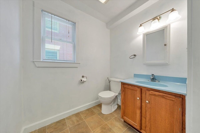 825 Day Ave SW, Roanoke, VA 24016 - half bathroom featuring toilet, vanity, and baseboards