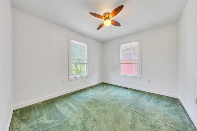 825 Day Ave SW, Roanoke, VA 24016 - empty room featuring carpet floors, baseboards, and ceiling fan