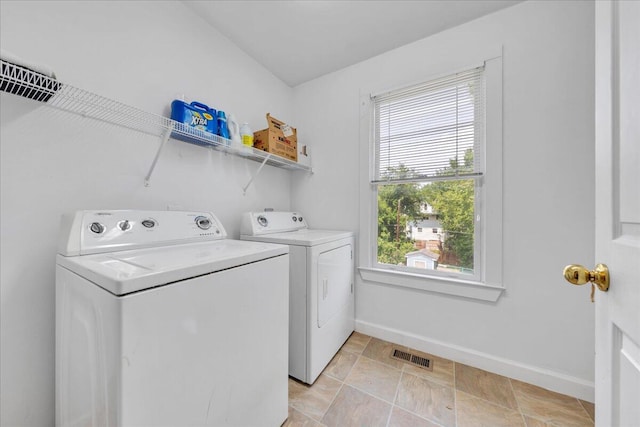 825 Day Ave SW, Roanoke, VA 24016 - washroom with separate washer and dryer, plenty of natural light, and baseboards