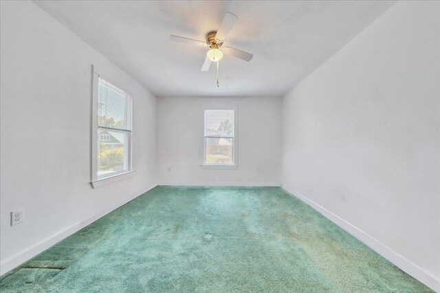 825 Day Ave SW, Roanoke, VA 24016 - unfurnished room featuring healthy amount of natural light, carpet floors, ceiling fan, and baseboards
