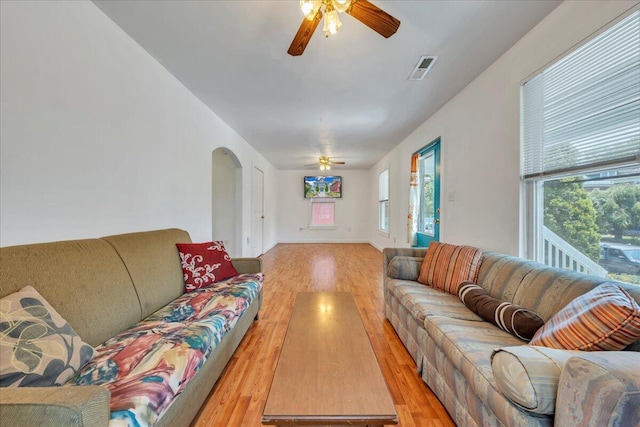 825 Day Ave SW, Roanoke, VA 24016 - living area with ceiling fan, light wood finished floors, and arched walkways