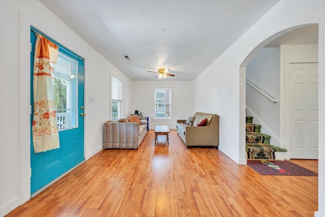 825 Day Ave SW, Roanoke, VA 24016 - living room featuring light wood-type flooring, stairway, baseboards, and ceiling fan