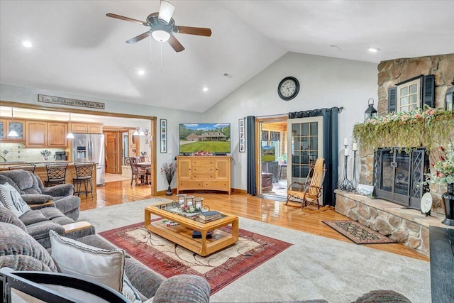 5335 Catawba Valley Dr, Catawba, VA 24070 - living room with light wood-type flooring, a ceiling fan, a fireplace, high vaulted ceiling, and recessed lighting
