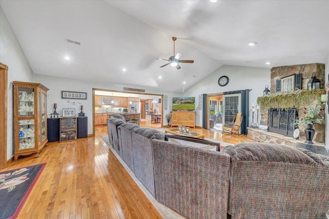 5335 Catawba Valley Dr, Catawba, VA 24070 - living room with lofted ceiling, ceiling fan, light wood finished floors, a stone fireplace, and recessed lighting