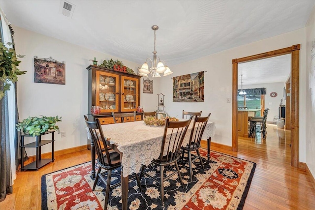 5335 Catawba Valley Dr, Catawba, VA 24070 - dining space featuring a chandelier and light wood finished floors