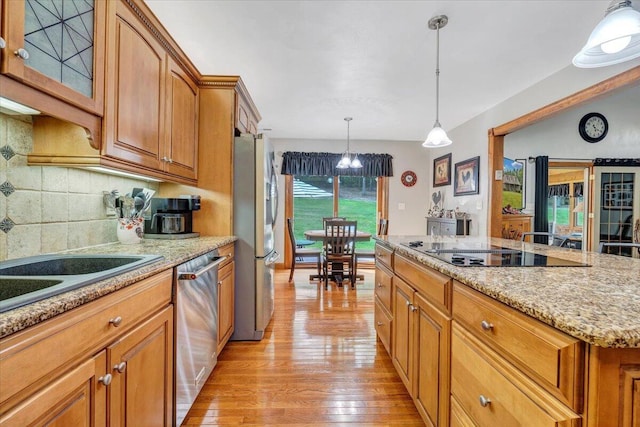 5335 Catawba Valley Dr, Catawba, VA 24070 - kitchen with appliances with stainless steel finishes, light wood-type flooring, brown cabinetry, and glass insert cabinets