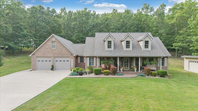 5335 Catawba Valley Dr, Catawba, VA 24070 - cape cod-style house featuring driveway, a porch, a front lawn, brick siding, and a shingled roof