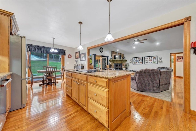5335 Catawba Valley Dr, Catawba, VA 24070 - kitchen featuring freestanding refrigerator, light wood-style flooring, black electric stovetop, a ceiling fan, and lofted ceiling