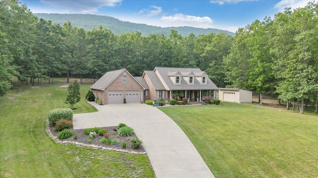 5335 Catawba Valley Dr, Catawba, VA 24070 - cape cod house featuring covered porch, a front lawn, concrete driveway, a view of trees, and an attached garage