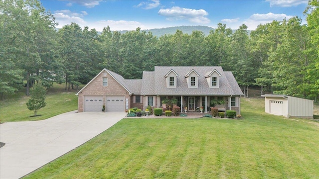 5335 Catawba Valley Dr, Catawba, VA 24070 - cape cod-style house featuring driveway, a porch, a front lawn, and an attached garage