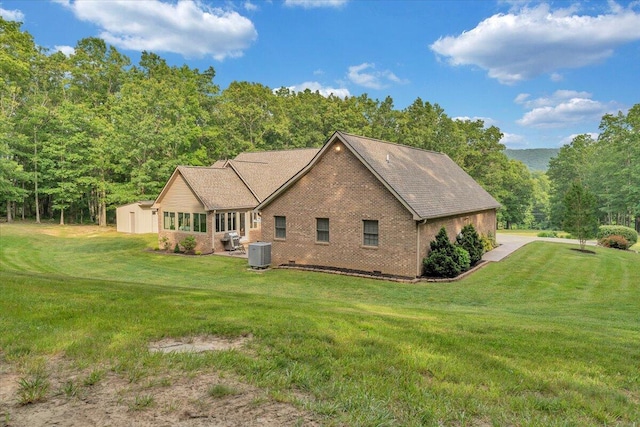 5335 Catawba Valley Dr, Catawba, VA 24070 - view of front facade featuring brick siding, a front lawn, and a shed