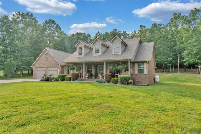 5335 Catawba Valley Dr, Catawba, VA 24070 - cape cod home featuring brick siding, covered porch, a front lawn, concrete driveway, and a shingled roof
