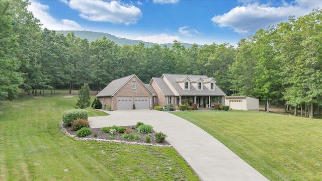 5335 Catawba Valley Dr, Catawba, VA 24070 - cape cod home with a front yard, a garage, and a forest view