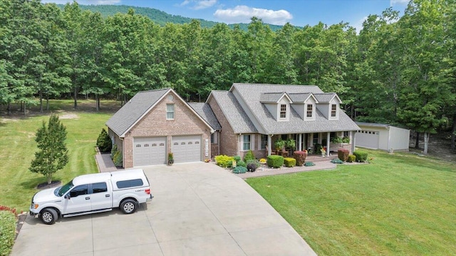 5335 Catawba Valley Dr, Catawba, VA 24070 - cape cod home with concrete driveway, brick siding, a front lawn, an attached garage, and a porch