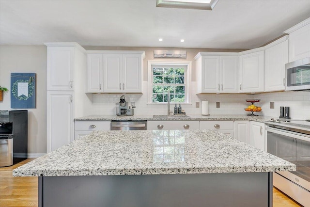 139 Lynville Dr, Hardy, VA 24101 - kitchen with stainless steel appliances, decorative backsplash, white cabinets, and recessed lighting