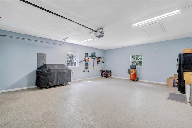 139 Lynville Dr, Hardy, VA 24101 - garage featuring a garage door opener, freestanding refrigerator, baseboards, and electric panel