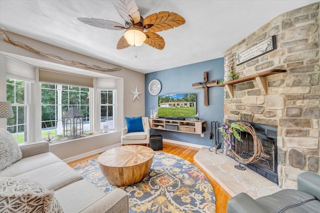 139 Lynville Dr, Hardy, VA 24101 - living area featuring a fireplace, wood finished floors, baseboards, and ceiling fan