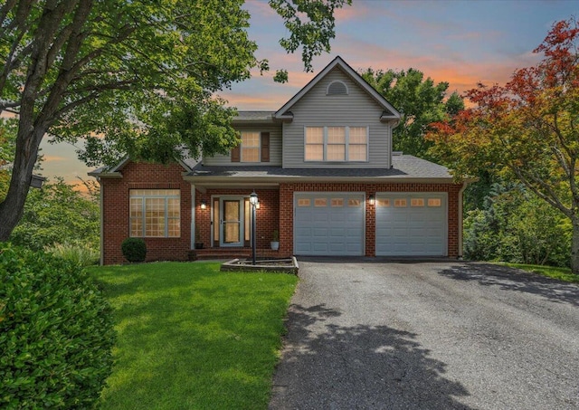 6061 Chagall Dr, Roanoke, VA 24018 - traditional-style home with a garage, driveway, a lawn, and brick siding