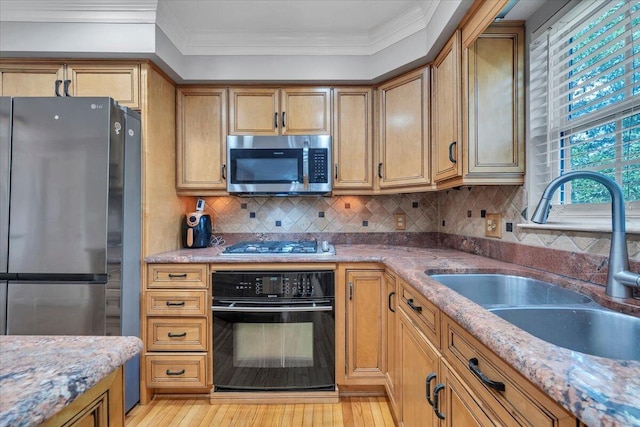 6061 Chagall Dr, Roanoke, VA 24018 - kitchen with appliances with stainless steel finishes, crown molding, light wood-style flooring, tasteful backsplash, and light stone countertops