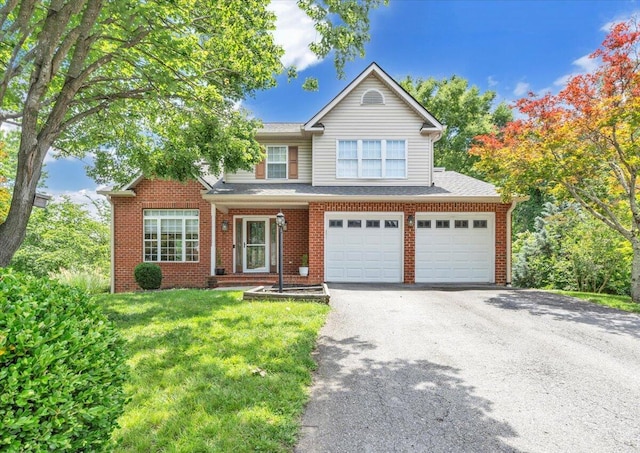 6061 Chagall Dr, Roanoke, VA 24018 - view of front of home featuring driveway, an attached garage, a front lawn, and brick siding