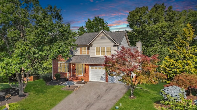 6061 Chagall Dr, Roanoke, VA 24018 - view of front of property with driveway, brick siding, a garage, a front yard, and a shingled roof