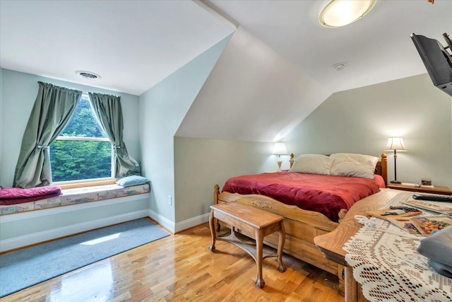 60 Tara Dr, Ridgeway, VA 24148 - bedroom with wood finished floors, baseboards, and lofted ceiling