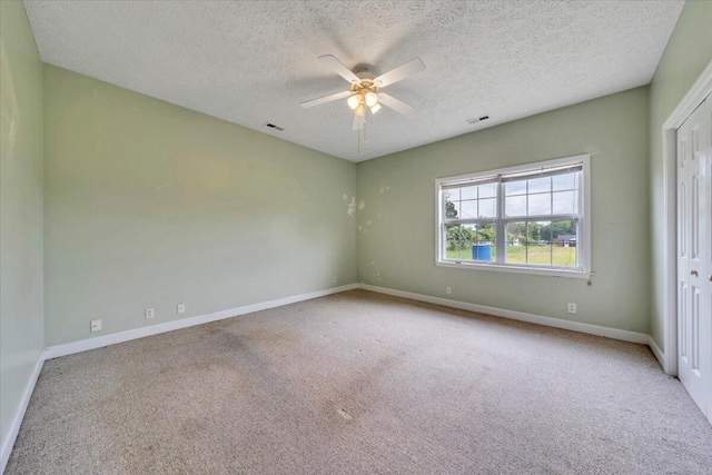 60 Tara Dr, Ridgeway, VA 24148 - empty room with carpet floors, a ceiling fan, a textured ceiling, and baseboards