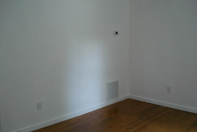 2419 Longview Ave SW Unit 15, Roanoke, VA 24014 - unfurnished room with dark wood-style flooring and baseboards