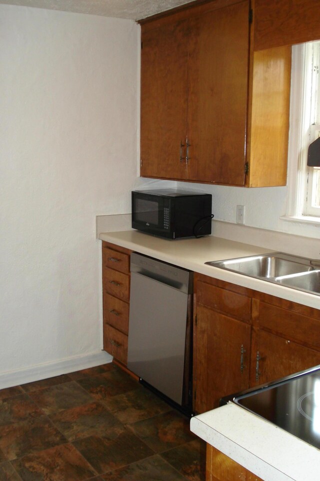2419 Longview Ave SW Unit 15, Roanoke, VA 24014 - kitchen with dishwasher, black microwave, brown cabinets, and light countertops