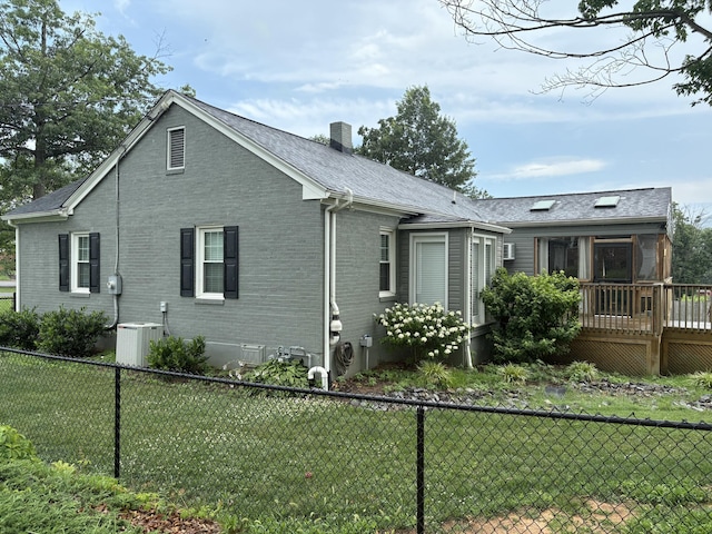 423 Turner Rd, Salem, VA 24153 - view of side of property with a fenced backyard, a deck, and brick siding