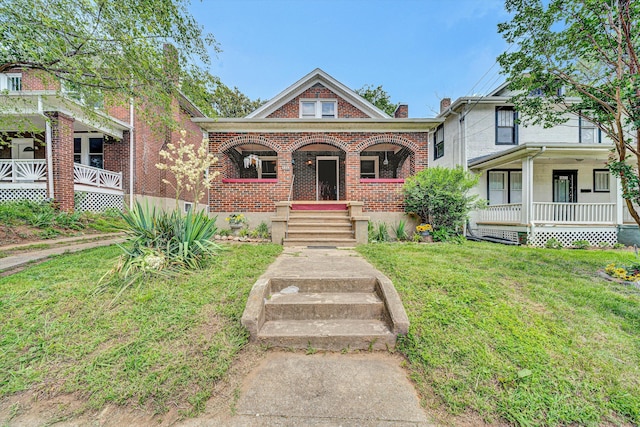 1618 8th St SE, Roanoke, VA 24013 - view of front facade featuring a porch, brick siding, and a front yard