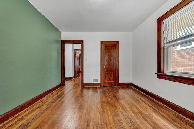 1618 8th St SE, Roanoke, VA 24013 - unfurnished room featuring dark wood-style floors and baseboards