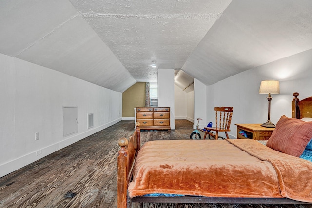 1618 8th St SE, Roanoke, VA 24013 - bedroom featuring wood finished floors, vaulted ceiling, baseboards, and a textured ceiling