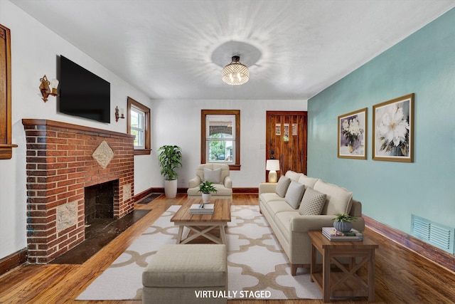 1618 8th St SE, Roanoke, VA 24013 - living area with wood finished floors, a fireplace, and baseboards