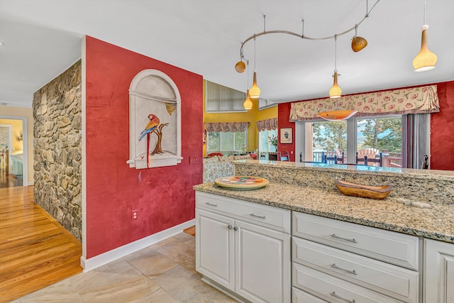 200 Fairway Dr, Penhook, VA 24137 - kitchen featuring white cabinetry, pendant lighting, and light stone counters