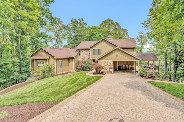 200 Fairway Dr, Penhook, VA 24137 - view of front of house featuring stone siding, a chimney, a front yard, decorative driveway, and roof with shingles