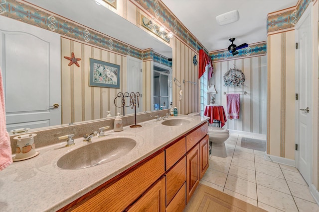 200 Fairway Dr, Penhook, VA 24137 - bathroom featuring wallpapered walls, toilet, tile patterned flooring, double vanity, and baseboards