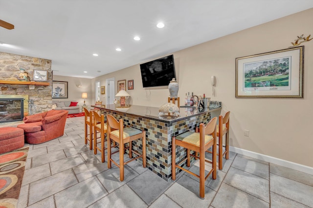 200 Fairway Dr, Penhook, VA 24137 - bar area with recessed lighting, a stone fireplace, and baseboards