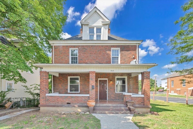 1523 Rorer Ave SW, Roanoke, VA 24016 - american foursquare style home featuring covered porch, brick siding, and a front lawn