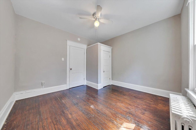 1523 Rorer Ave SW, Roanoke, VA 24016 - spare room with radiator, a ceiling fan, baseboards, and dark wood-type flooring