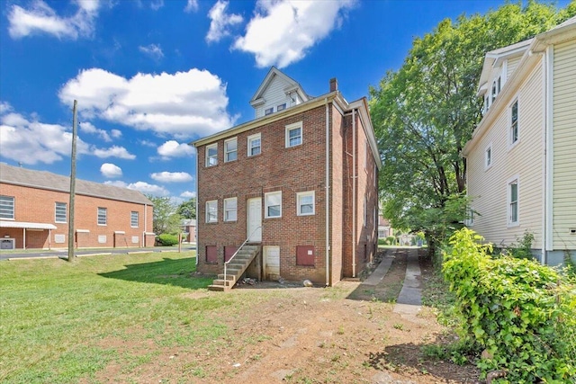 1523 Rorer Ave SW, Roanoke, VA 24016 - rear view of house with brick siding and a lawn