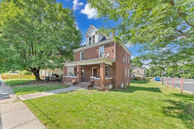 1523 Rorer Ave SW, Roanoke, VA 24016 - american foursquare style home with brick siding, a porch, and a chimney