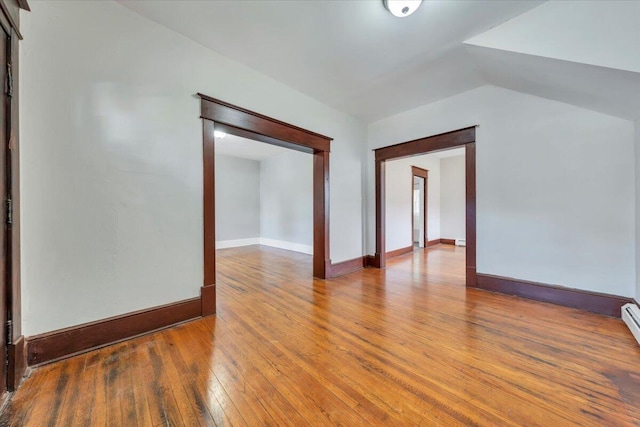 1523 Rorer Ave SW, Roanoke, VA 24016 - unfurnished room with hardwood / wood-style floors, lofted ceiling, and baseboards