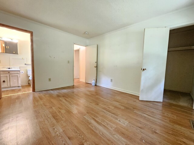 3 Pine Ln, New Castle, VA 24127 - unfurnished bedroom featuring crown molding, light wood-style floors, ensuite bath, and baseboards
