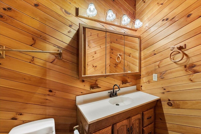 612 Peters Creek Dr, Stuart, VA 24171 - half bathroom featuring wooden walls and vanity